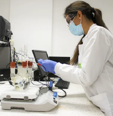 Photo showing a member of one of the research groups working in one of the laboratories