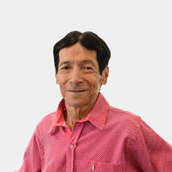 The photo was taken in the foreground, white background and the professor Hector Mendez is located in the center.