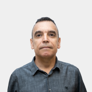 The photo was taken in the foreground, white background and the professor Jhon Caceres is located in the center.